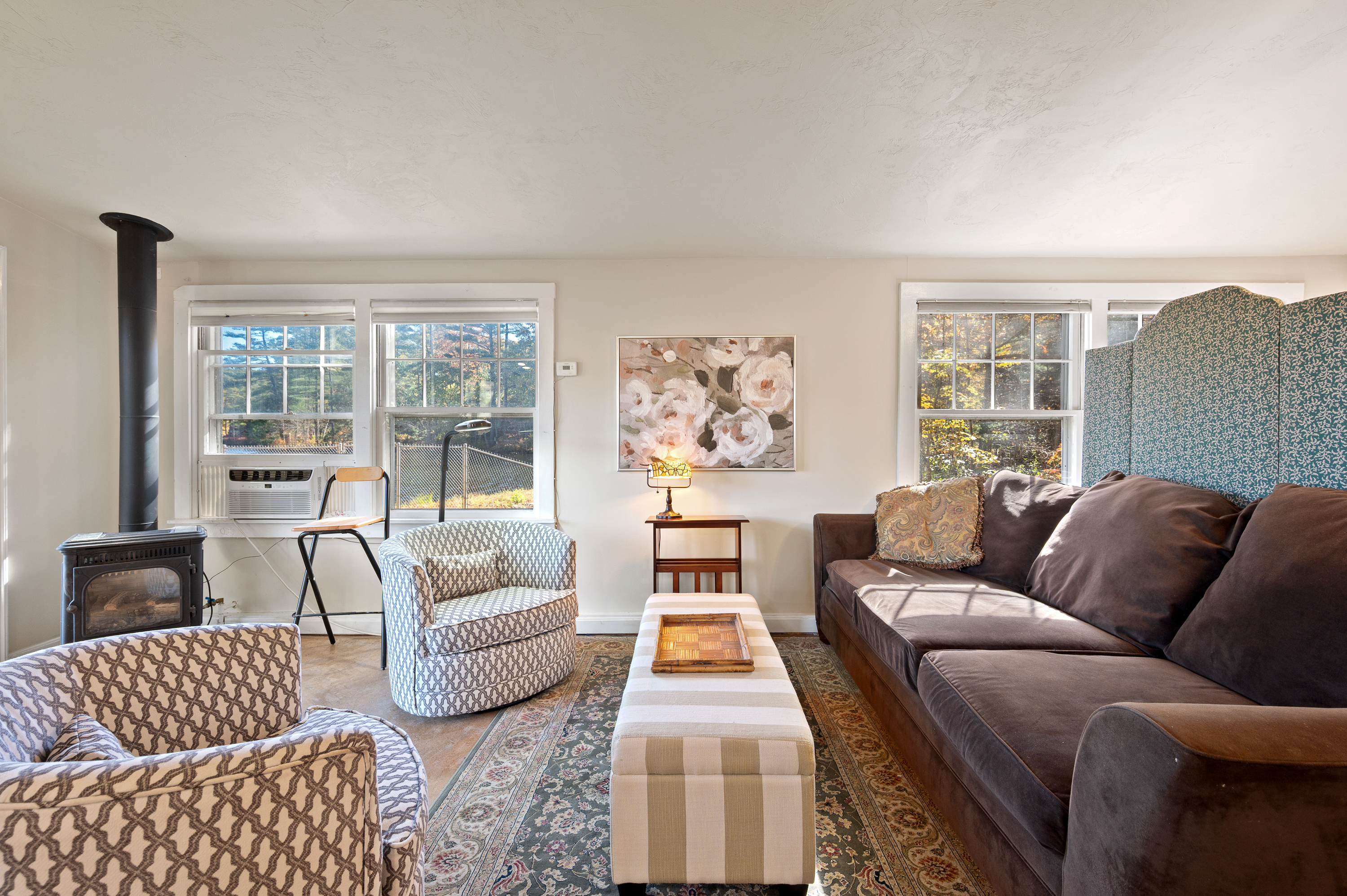 Bright and cozy living room with comfortable seating and natural light.