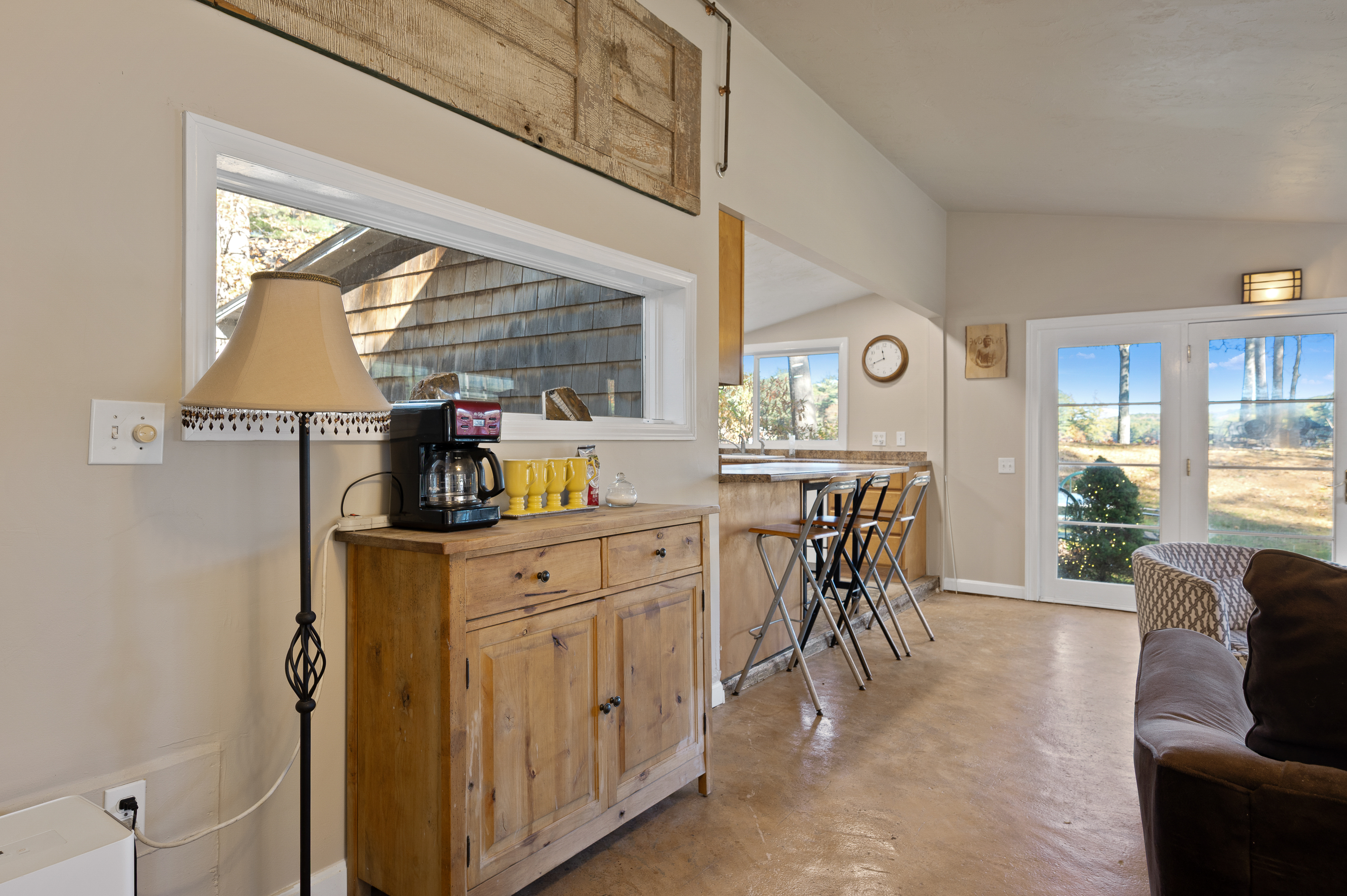 Cozy kitchen corner with wooden cabinets and a coffee maker.