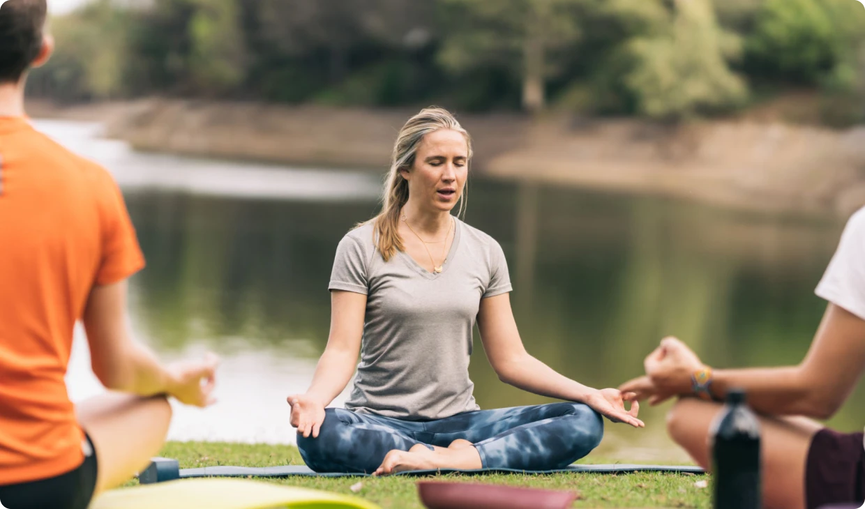 People practicing meditation in nature