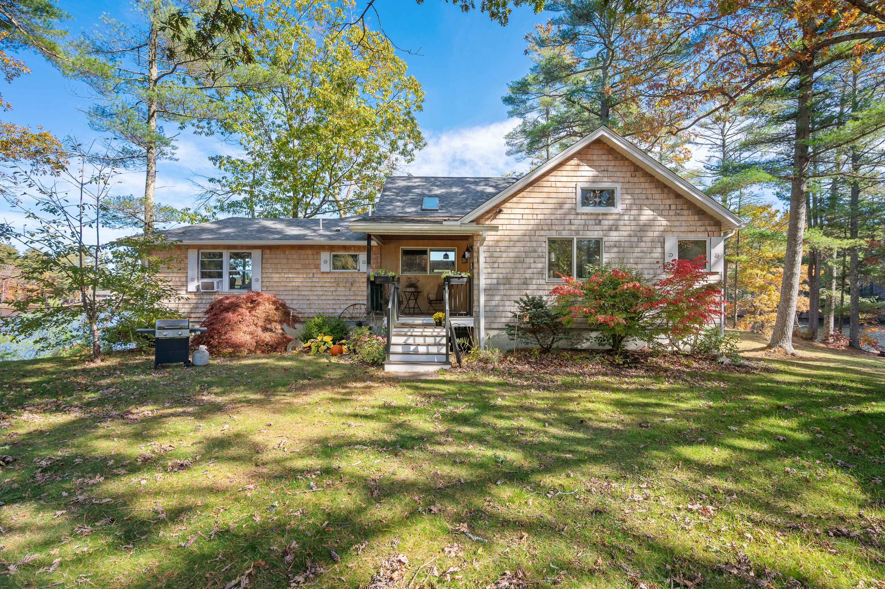 Charming single-story house with stone exterior and front porch.