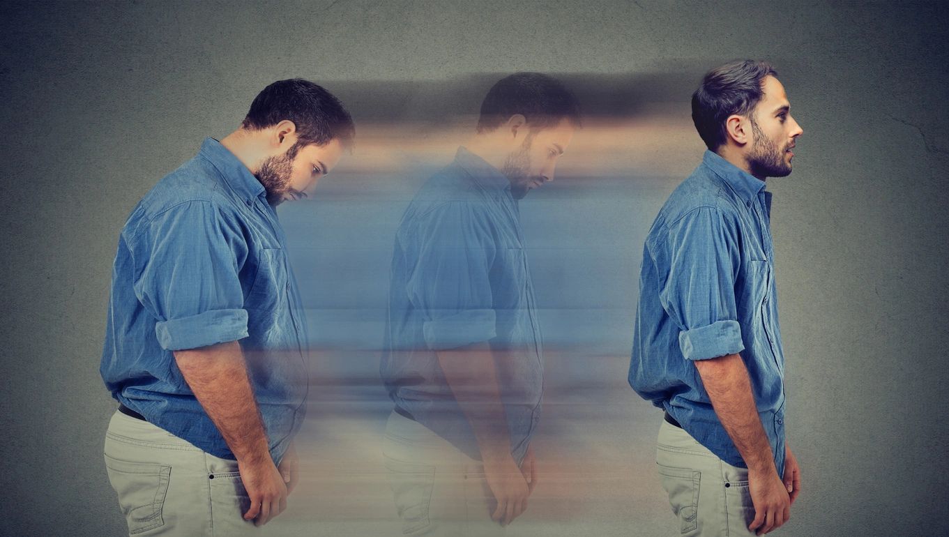 Man fading into a blur, symbolizing transition or emotional struggle.